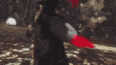 a video game character with a red tail