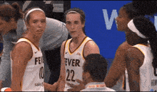a group of female basketball players wearing jerseys that say ever 22