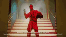 a man in a red outfit is standing on a set of stairs and says hombre