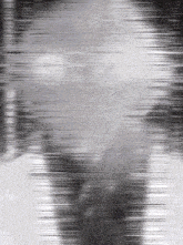 a black and white photo of a person 's face with a beard .