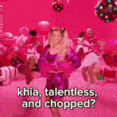 a woman in a purple sequined dress is dancing in a pink room with balloons .