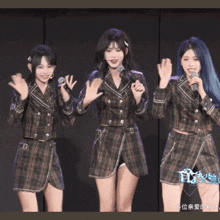 three girls standing next to each other with microphones in their hands