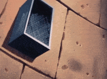 a brick wall with holes in it and a box in the middle