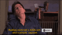 a man in a blue shirt says radšej zomriet s aids-om ako s plnom vajcom