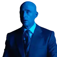 a bald man in a blue suit and tie is looking at the camera