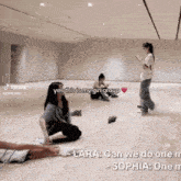 a group of people are sitting on the floor in a room with the words yes this is my girl group on the top