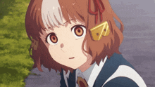 a close up of a girl 's face with the letter b on her earring