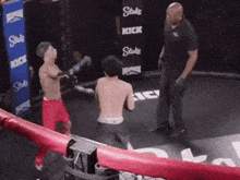 a man in a boxing ring with a sign that says stake kick on it