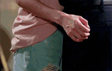 a man and a woman are hugging each other .