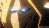 a close up of a person 's face with glowing blue eyes .