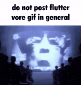 a group of people standing in front of a screen that says " do not post flutter vore gif in general "