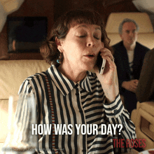 a woman in a striped shirt is talking on a cell phone with the words " how was your day " below her