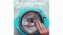 a person is adding raspberry flavor to a pot of water .