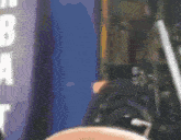 a blurred image of a person standing in front of a sign that says nba