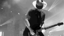 shreading lead guitar music performing cowboy hat