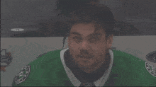a man in a green jersey with the word ford on the side