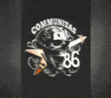 a black t-shirt with a skull and the words communitas 86