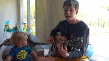 playing a song carson lueders lullaby singing guitar