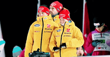 a group of people wearing yellow jackets that say wurth terrex