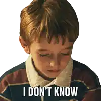 a young boy says i don 't know in a striped shirt