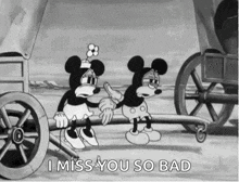 mickey mouse and minnie mouse are sitting on a wagon pulled by a horse drawn carriage .