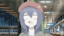 a girl in a pink hat with a smiley face on it