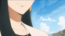 a close up of a woman 's face with a blue sky behind her