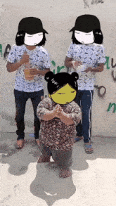 a group of people are standing in front of a wall with graffiti on it including the letter n