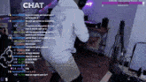 a man is dancing in front of a microphone on a twitch stream ..
