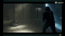 a silhouette of a man standing in a dark room with a caption that says capcut