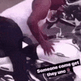 a man is standing next to a motorcycle with the words `` someone come get they unc '' written on the bottom .