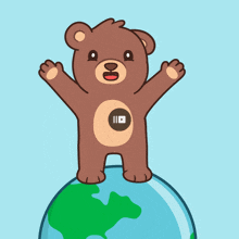 a teddy bear is standing on top of a globe with its arms outstretched