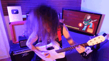 a man is playing a guitar in front of a youtube channel