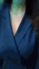 a close up of a person 's chest with a button that says ' a ' on it