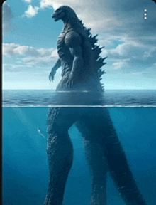 a statue of a monster is floating in the ocean .