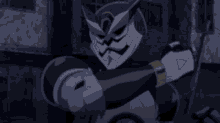 a close up of a person holding a gun in a dark room .