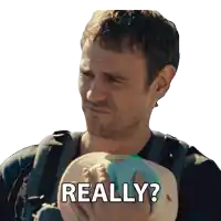 a man holding a baby with the words " really " written below him