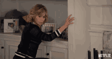 a netflix ad shows a woman reaching into a closet