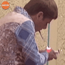 Lighting Up A Cigarette Buzzr GIF - Lighting Up A Cigarette Buzzr Taking A Smoke Break GIFs