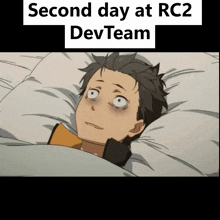 a man laying in bed with the words second day at rc2 devteam