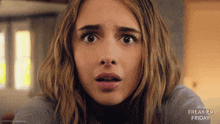 a close up of a woman 's face with the words freakier friday on the bottom right
