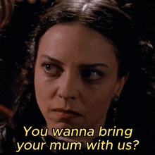 a woman says " you wanna bring your mum with us " in yellow letters