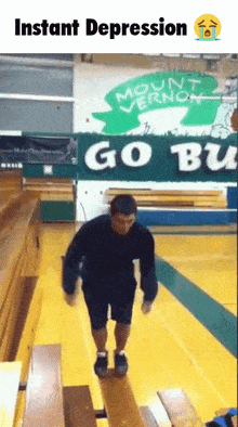 a man is standing on a balance beam in front of a sign that says " instant depression "