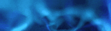 a blue background with a blurred image of a person 's face