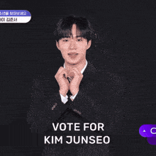 a man in a suit and tie says vote for kim junseo