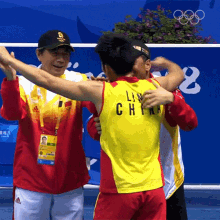 hug lin dan olympics embrace pat back