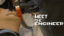 a person is working on a water heater and the words meet the engineer are on the bottom
