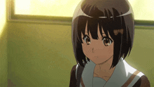 a girl with short hair and a bow on her head looks at the camera