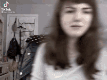 a blurry picture of a woman 's face with the words tiktok @vsp_sophia on the bottom