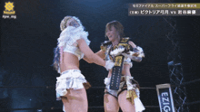 two women hugging each other with a sign that says #pw_mg in the corner